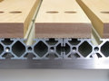 slats span adjacent extrusion sections